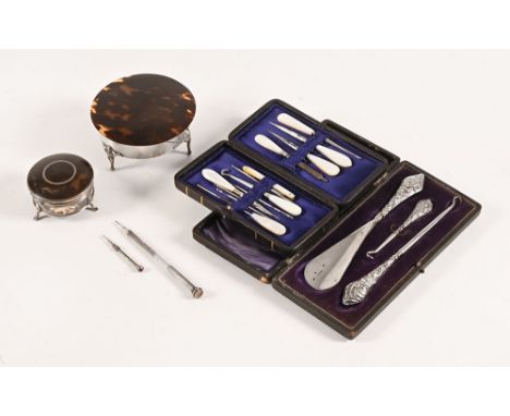 Two silver tortoiseshell mounted dressing table boxes, seal top pencil, sewing kit and shoehorn set in case.