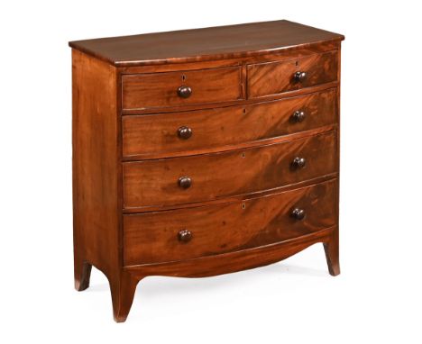 A 19th century mahogany bowfronted chest of drawers, two short and three long with wooden knob handles all raised on splayed 