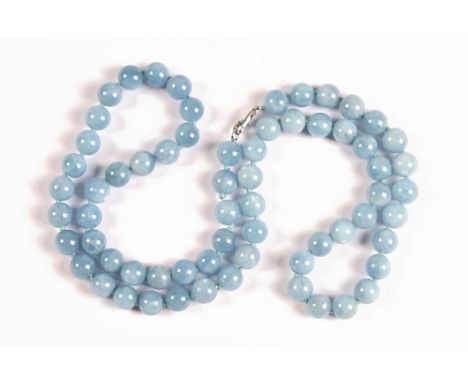 A pale blue jade style polished necklace.   CONDITION REPORT:  The lot is in excellent condition, we can see no signs of any 