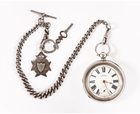 A large key wind silver pocket watch by Waltham, together with a silver Albert chain.  Case diameter 55 mm.   CONDITION REPOR