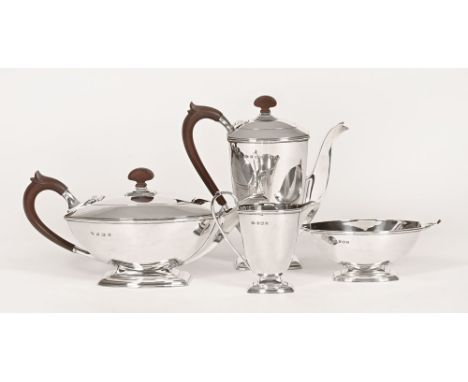 An Adie Brothers Ltd four piece silver tea coffee service, with composition handles hallmarked Birmingham, the coffee pot dat