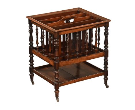 An early Victorian rosewood Canterbury, the top section with four apertures and with shelf below raised on turned legs termin