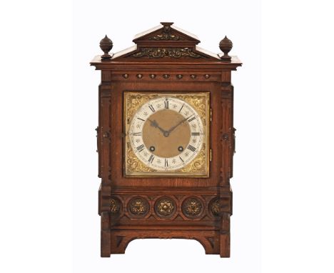 An Edwardian oak bracket clock, with two train spring driven movement striking on two gongs.  Height 44 cm, width 28 cm, dept