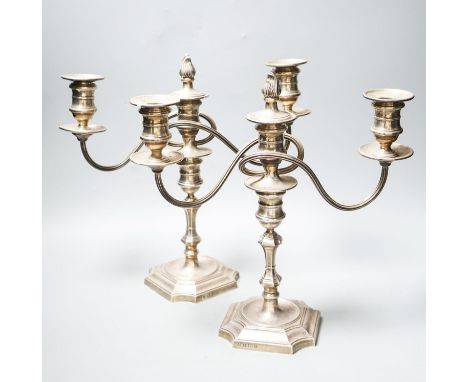A pair of modern 1970's silver two branch, three light candelabra, height 30.4cm, weighted.