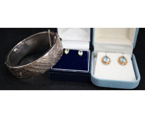 Two pairs of semi precious gem set ear rings including one 9ct gold set and a boxed silver bangle.