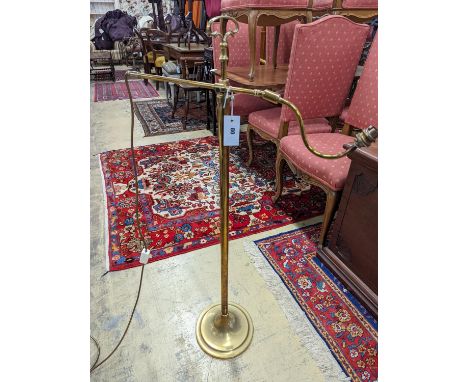 An Edwardian brass telescopic floor lamp converted to electricity