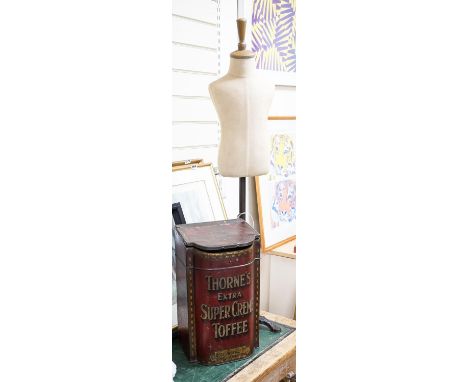 A mannequin on cast iron stand, height 103cm, and a retailer's Thorne's Toffee can