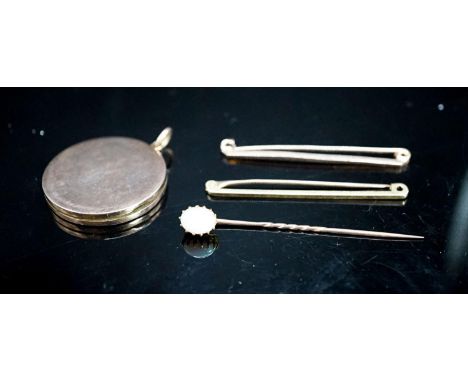 An 18ct bar brooch, 50mm, 2 grams, a 9ct bar brooch, 1.8 grams, a white opal set stick pin and a yellow metal locket.