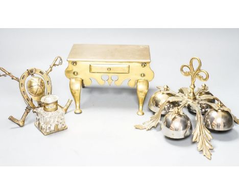 A brass Jockey-related inkwell, a miniature brass footman and brass  hand bells