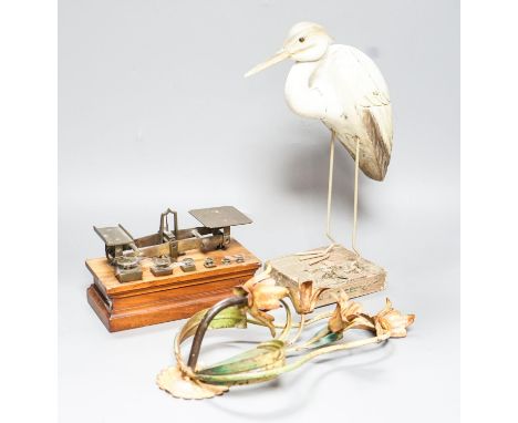 A Ratcliff weighing scale, a painted wrought iron floral wall light, a model of a stork, 33cm