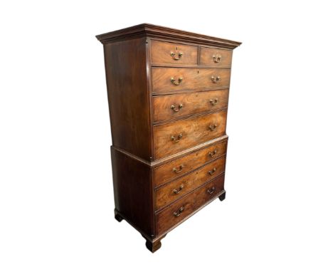 A 19th century mahogany secretaire chest-on-chest with two short and two graduated long drawers above a secretaire drawer wit