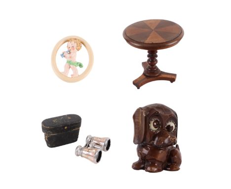 A miniature George III style tilt-top tripod table with segmented top and turned column with triform platform, 14cms diameter