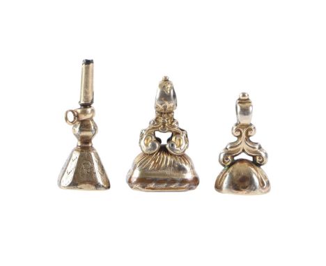 Two Victorian gilt metal intaglio seals; together with a similar pocket watch key (3).