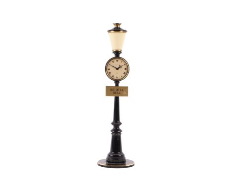 A Jaeger LeCoultre novelty table clock in the form of a street lamp, with street sign 'Rue de La Weill', 29cm high.