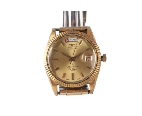 A gentleman's Technos Star chief Automatic wristwatch with baton indices, sweeping seconds and day-date aperture.