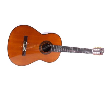 A Yamaha G-250S six-string acoustic guitar, 100cms long.