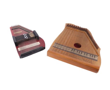 A zither, 40cms wide; together with another, 25cms wide (2).