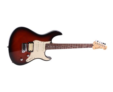A Yamaha Pacifica six-string electric guitar with Whammy bar, in a soft carry case, 98cms long.