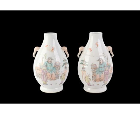 A pair of Chinese Republic famille rose vases decorated with a dignitary and his attendants, with calligraphy, red seal mark 