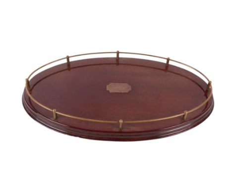 Horse racing interest:  An oval mahogany tray with brass gallery,  bearing a presentation plaque 'The Ladbroke Credit Express