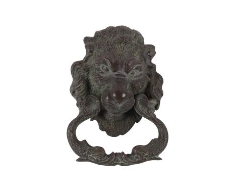 A cast bronze lion mask door knocker, overall 14cm high.