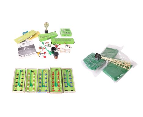 A quantity of vintage Subbuteo to include boxed teams and stadium floodlights.