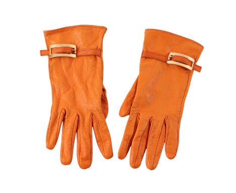 A pair of Versace orange kid leather ladies gloves.Condition ReportStitching and leather both in good condition with no damag