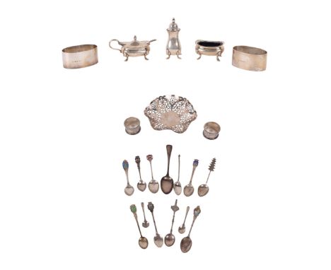 A small collection of silver items to include a pair of napkin rings, a bonbon dish, spoons, mustard pot, pepperette and othe
