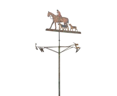 A large wrought iron weather vane surmounted a huntsman and hounds. 196cm high