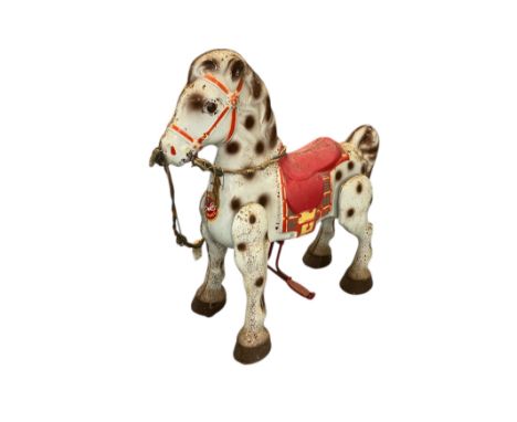 A vintage Mobo tin plate Bronco horse.