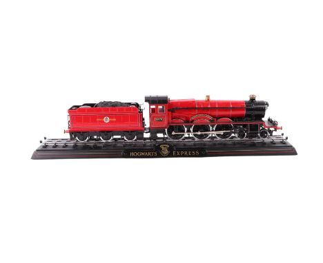 A 1:50 scale diecast train model of the Hogwarts Express, boxed, overall 56cms long.