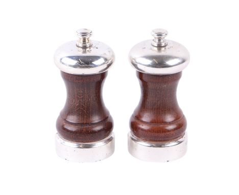 A pair of modern silver and hardwood salt and pepperette, Birmingham 1991, each approx 10cms high.