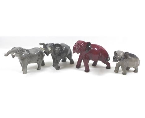 A group of elephants figurines, including a Beswick 'Elephant - Trunk stretching - small', model 974, grey gloss, 12cm high, 