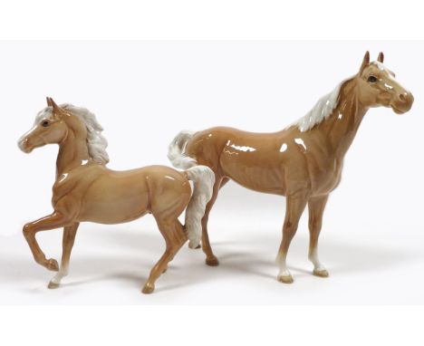 Two palomino Beswick horses, comprising 'Swish Tail Horse', First Version, model 1182, palomino - gloss, 22.2cm high, and 'Pa