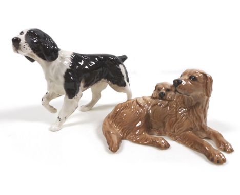 A Beswick Royal Doulton 'Springer Spaniel', model 3135, RD and '107' stamped to the feet, dark brown and white - gloss, 12.7c