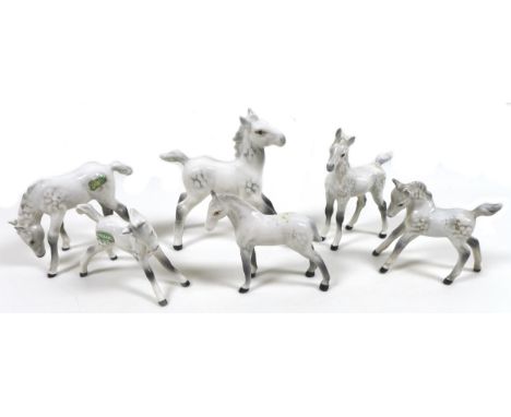 A group of six Beswick Foals, including 'Foal (Large, stretched)', model 836, grey - gloss, a/f, 12.7cm high, 'Foal (Grazing)