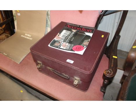 A Hohner piano accordion in fitted case