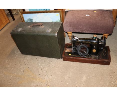 An electric Singer sewing machine - sold as collector's item in carry case