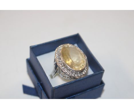 A large Sterling silver dress ring set with citrine and white stones, size Q/R