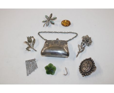 A collection of brooches including silver and jade examples ; and a silver plated purse