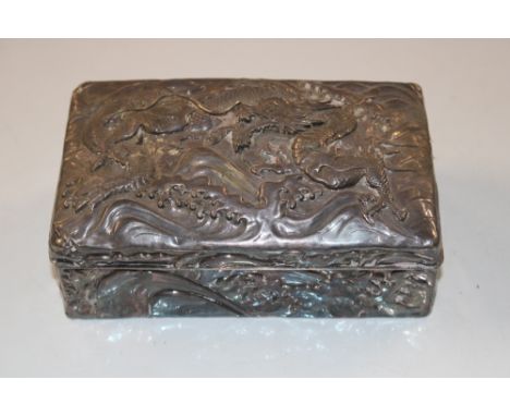 A white metal hinged dragon decorated trinket box AF