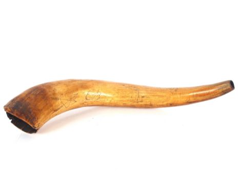 An 18th Century cow horn inscribed with heart, arrow, sailing ship and palm, initialled and dated 1777, approx. 48cm long 