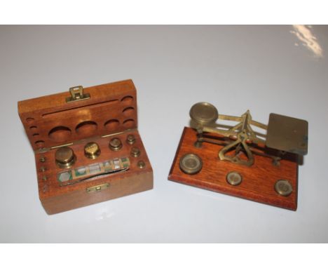 A cased set of scales; and a set of postage scales