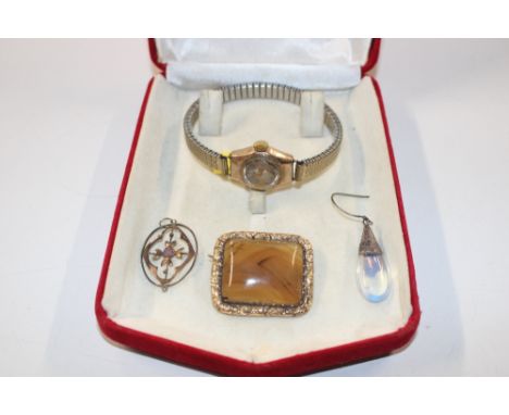 A 9ct gold cased ladies Rotary wrist watch; a yellow metal and stone set brooch; a 9ct and amethyst coloured stone pendant; a