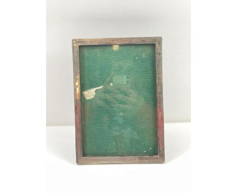 An early 20th century rectangular silver photo frame, Birmingham, Cornelius Desormeaux Saunders &amp; James Francis Hollings 