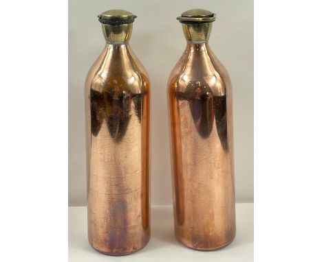 A pair of early 20th century coppered insulated bottles, each with a carry ring 