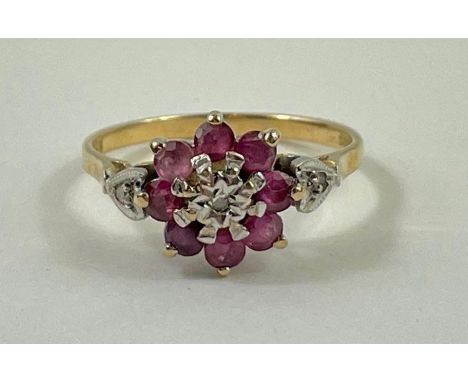 A 9ct gold ruby and diamond cluster ring, finger size N 1/2, 2.11g gross