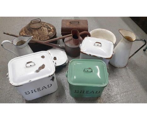 A good collection of enamel wares including bread bins, jugs, water can and other items 