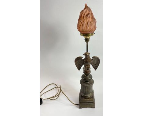 A 20th century American spelter lamp, with a standing eagle and glass flame lamp shade, 73cm high
