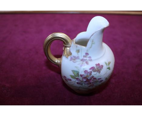 A Royal Worcester blush ivory hand painted jug with initials S. H to base 